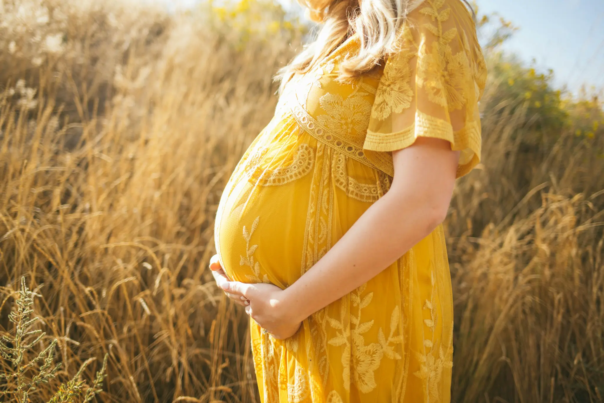 Pregnant woman in calm morning light